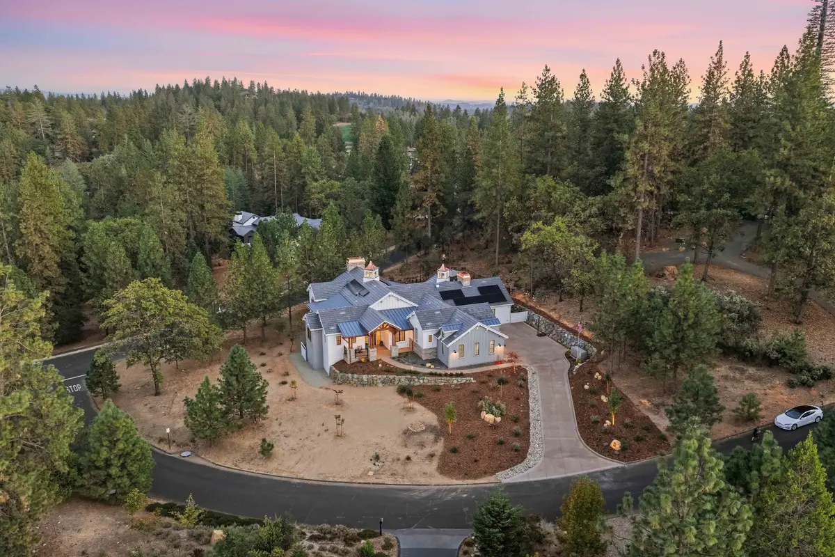 Meadow Vista · a farmhouse nestled in pine forest at sunset