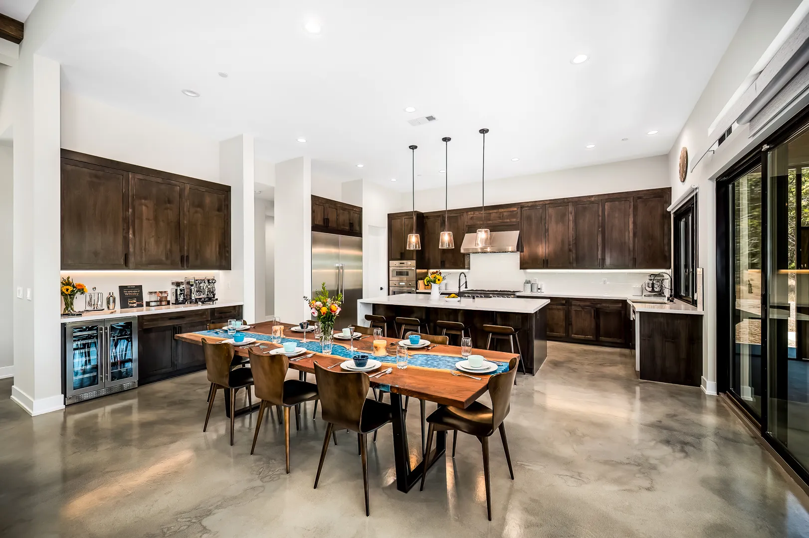 Great room with clerestory windows opening toward the kitchen in a Sherman custom home